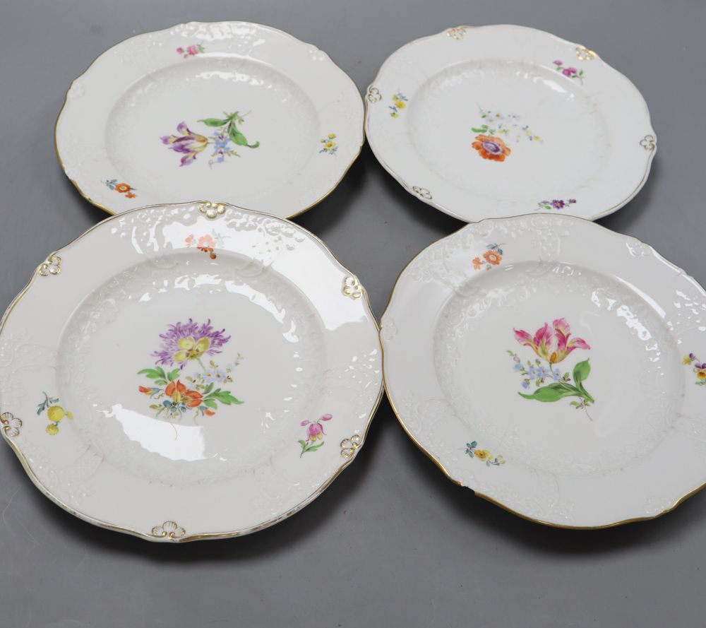 A set of four Meissen dishes, painted with scattered floral sprigs